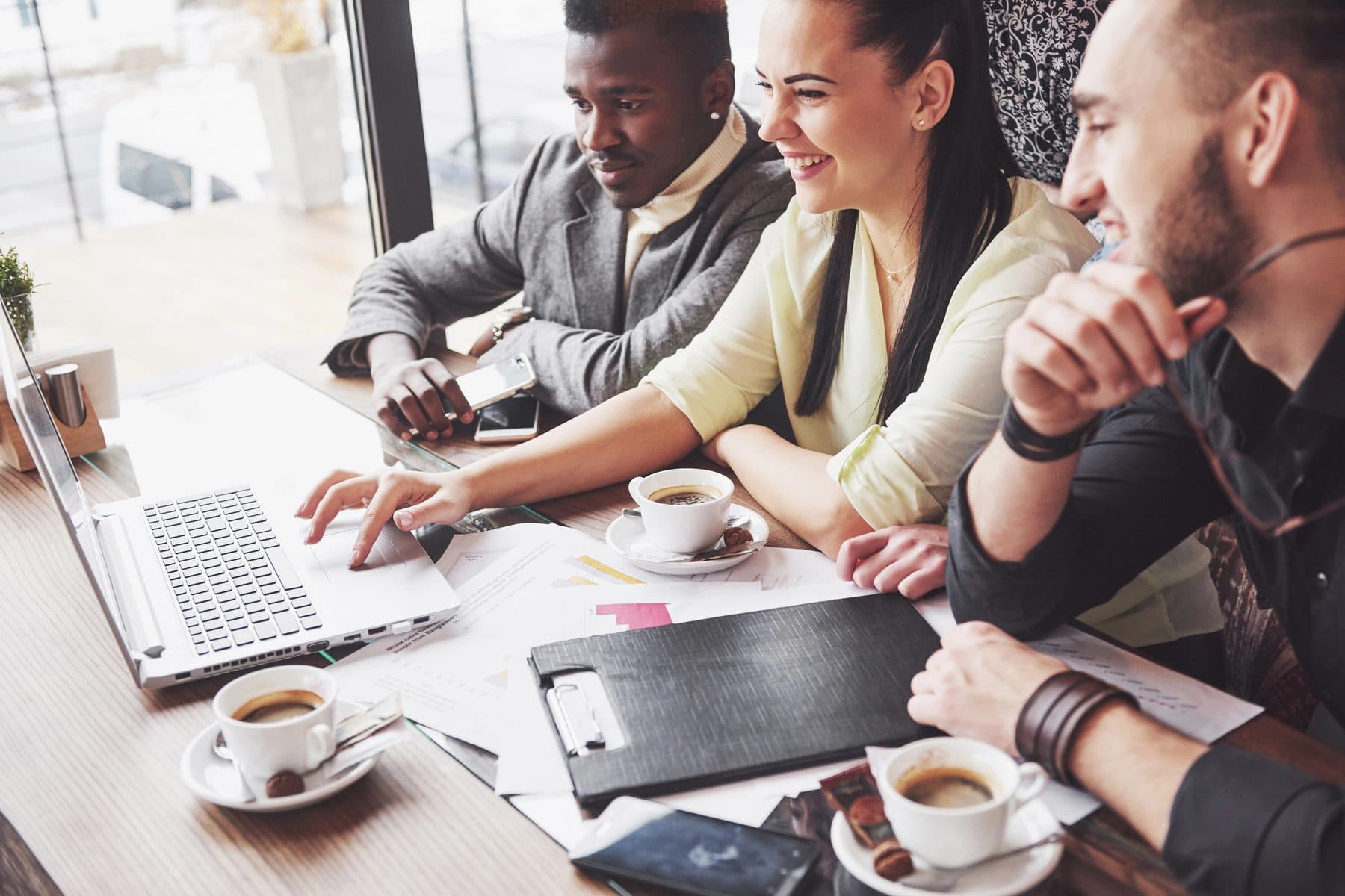 A business team reviewing plans together around a table